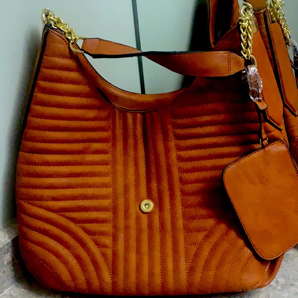 Dark garnet coloured leather bag, gold decor. New